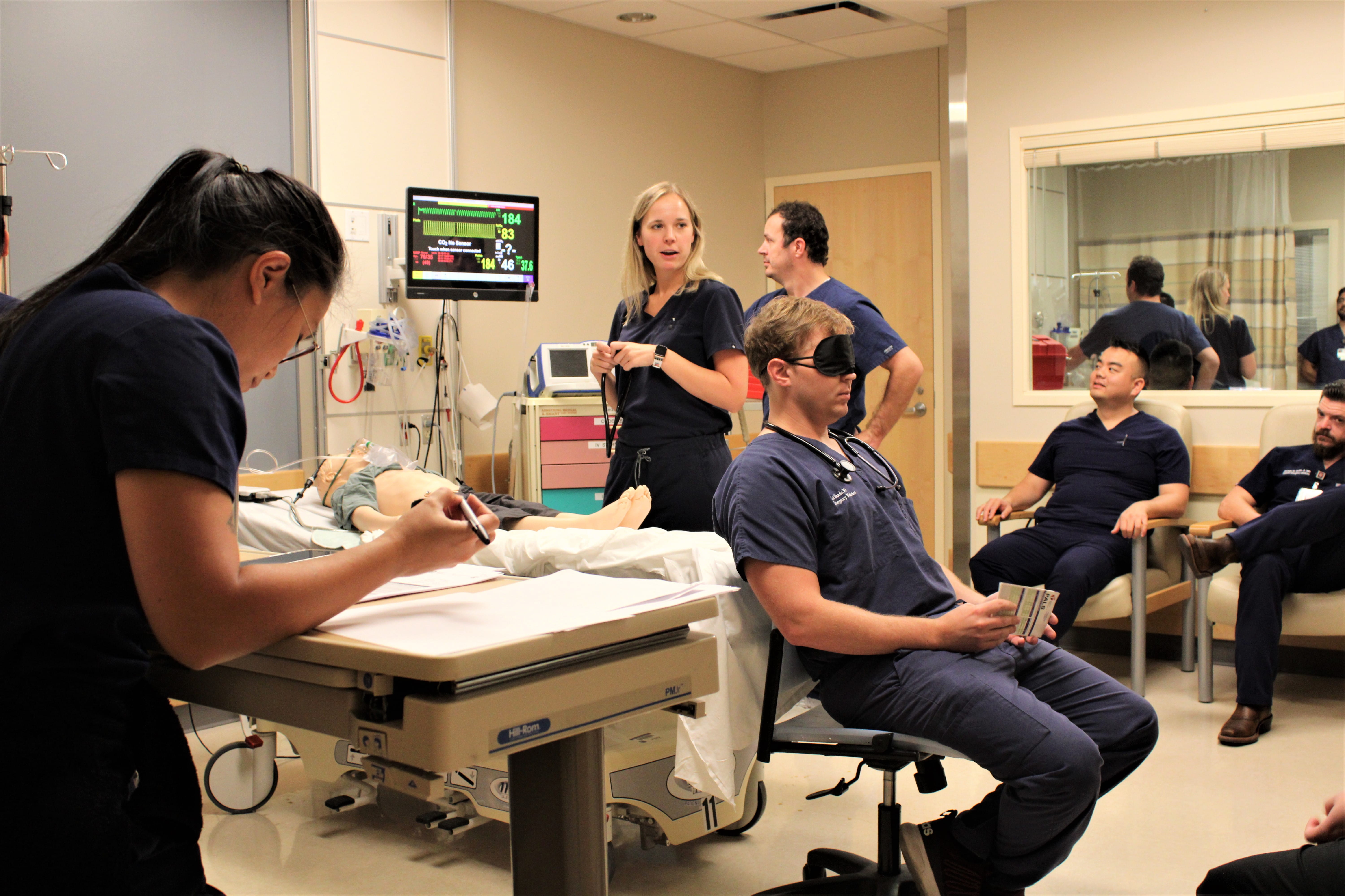 PEM fellows running a pediatric emergency medicine simulation. 