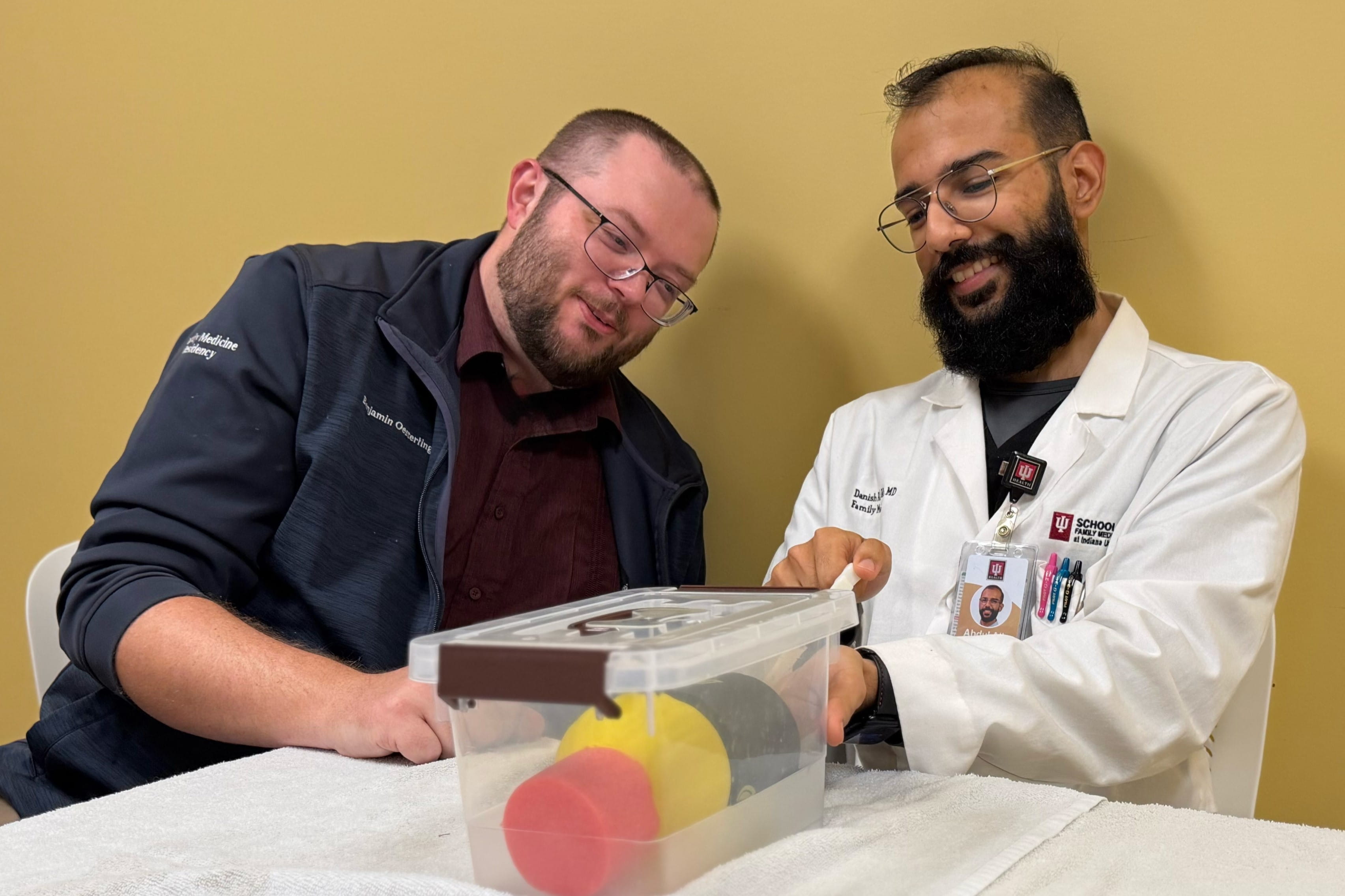 A resident participates in a procedure raining session with a faculty member. patient in the pediatric inpatient rotation.