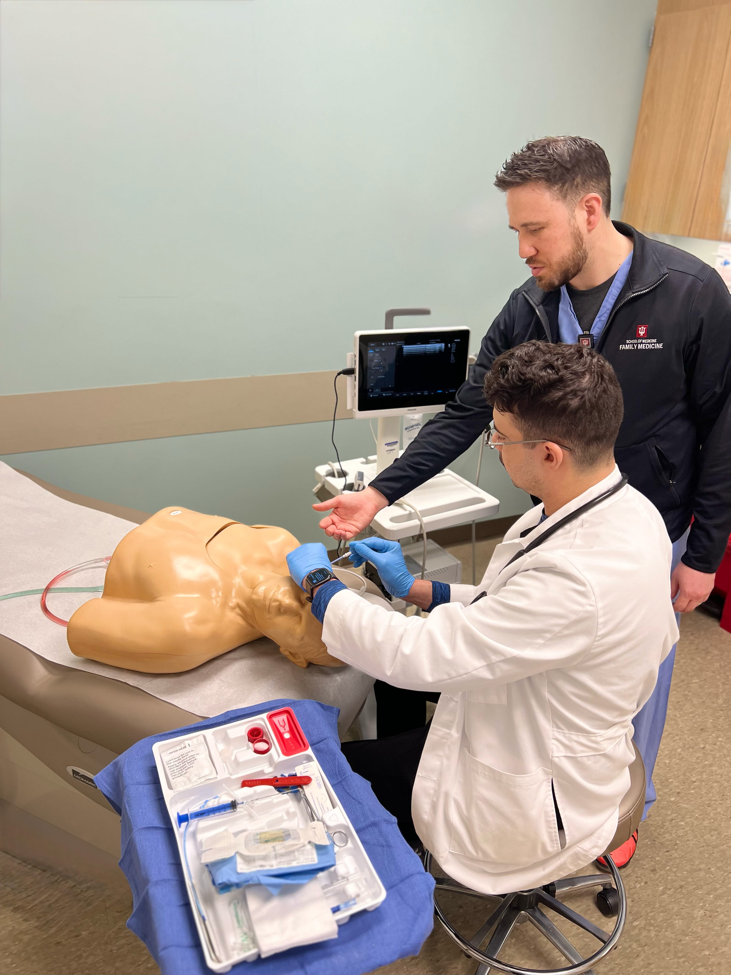 Arnett Family Medicine faculty member teaching resident.