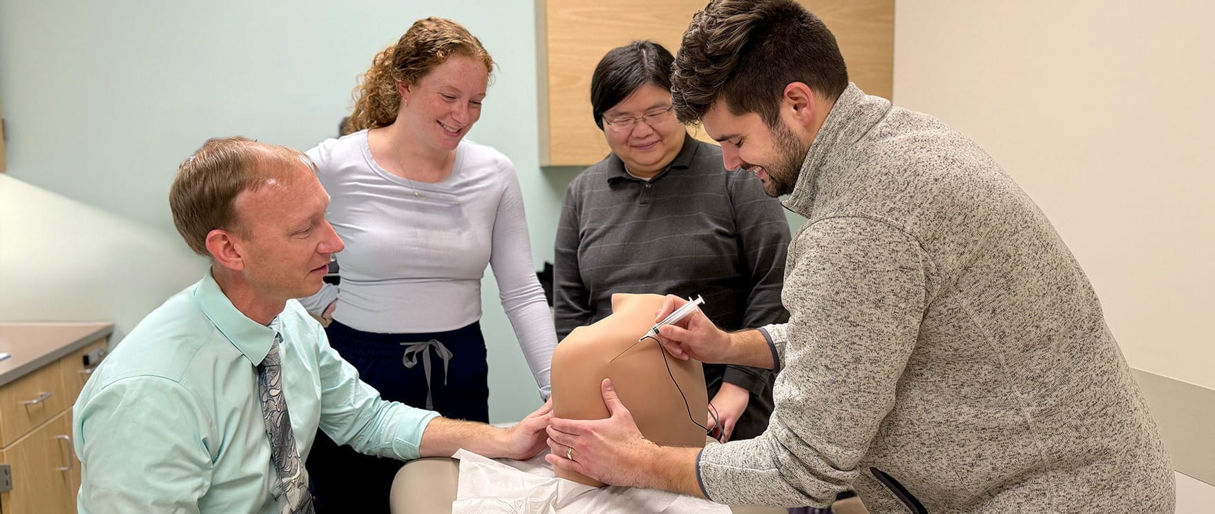 residents practice clinical skills under the guidance of a faculty member in west lafayette