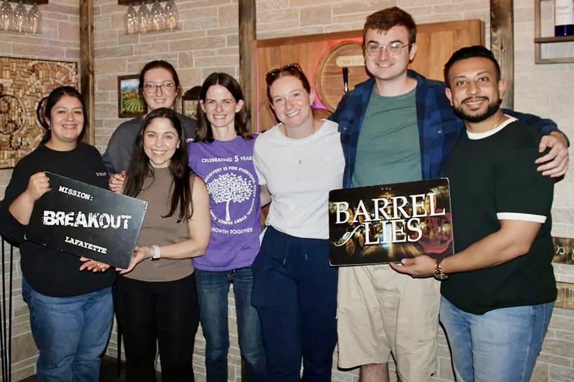 IU Health Arnett Family Medicine Residents posing for a picture at a escape room.