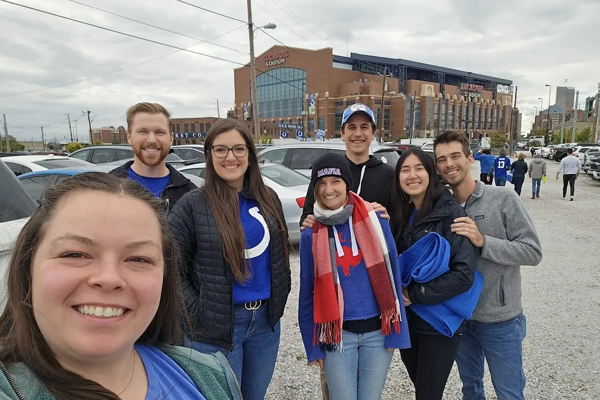 Residents outside on a fall day in front of the colts' football stadium