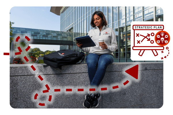 student works on a laptop outside the iu indianapolis campus center