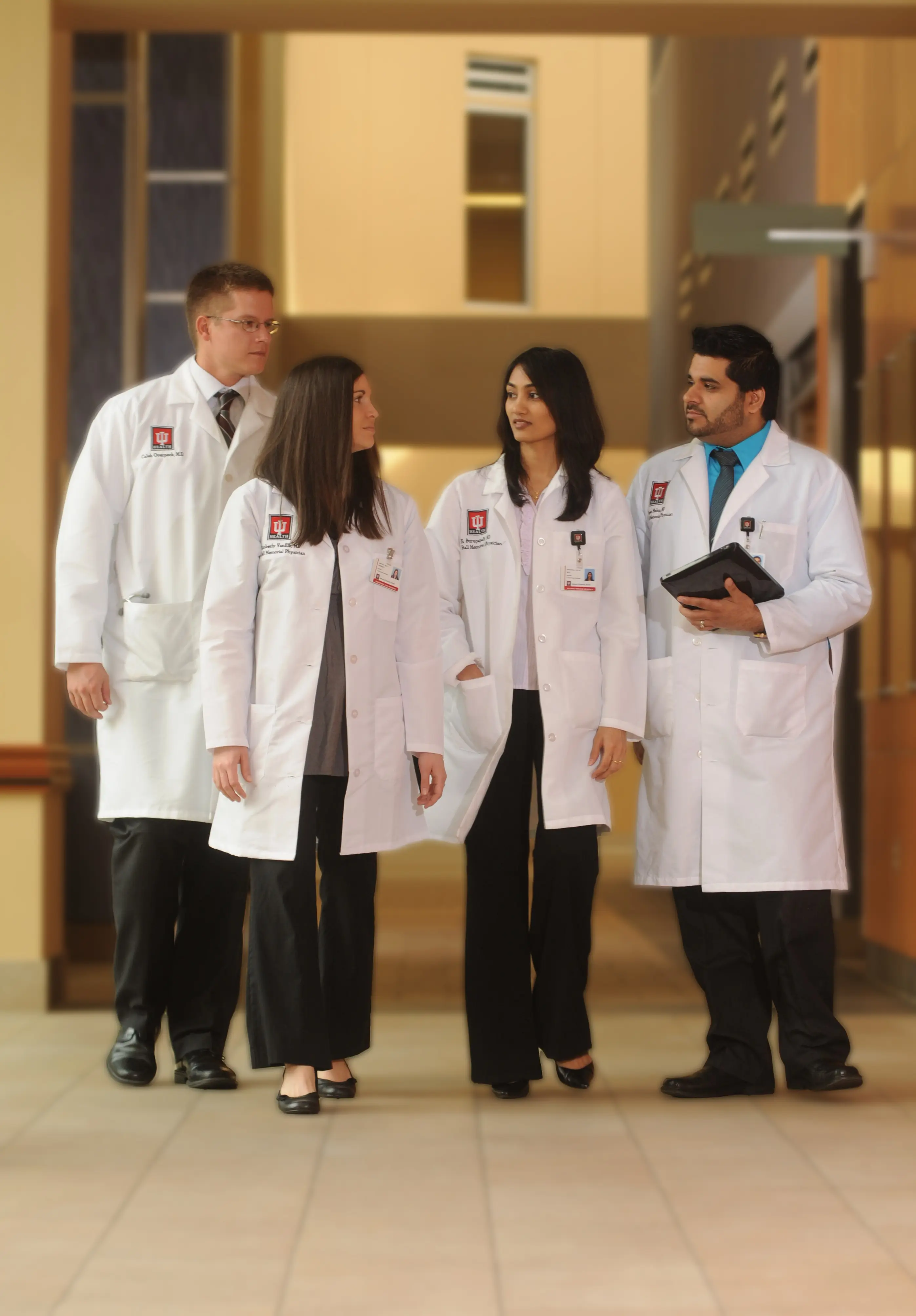 residents walk down the hall together