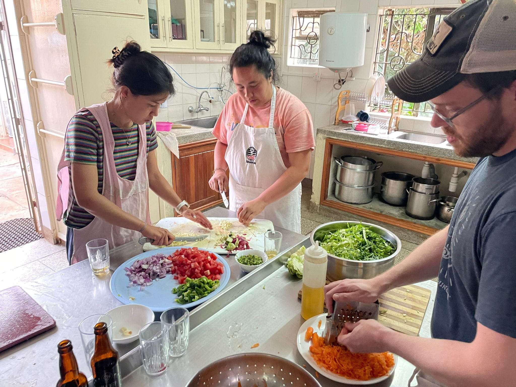 three residents cooking together