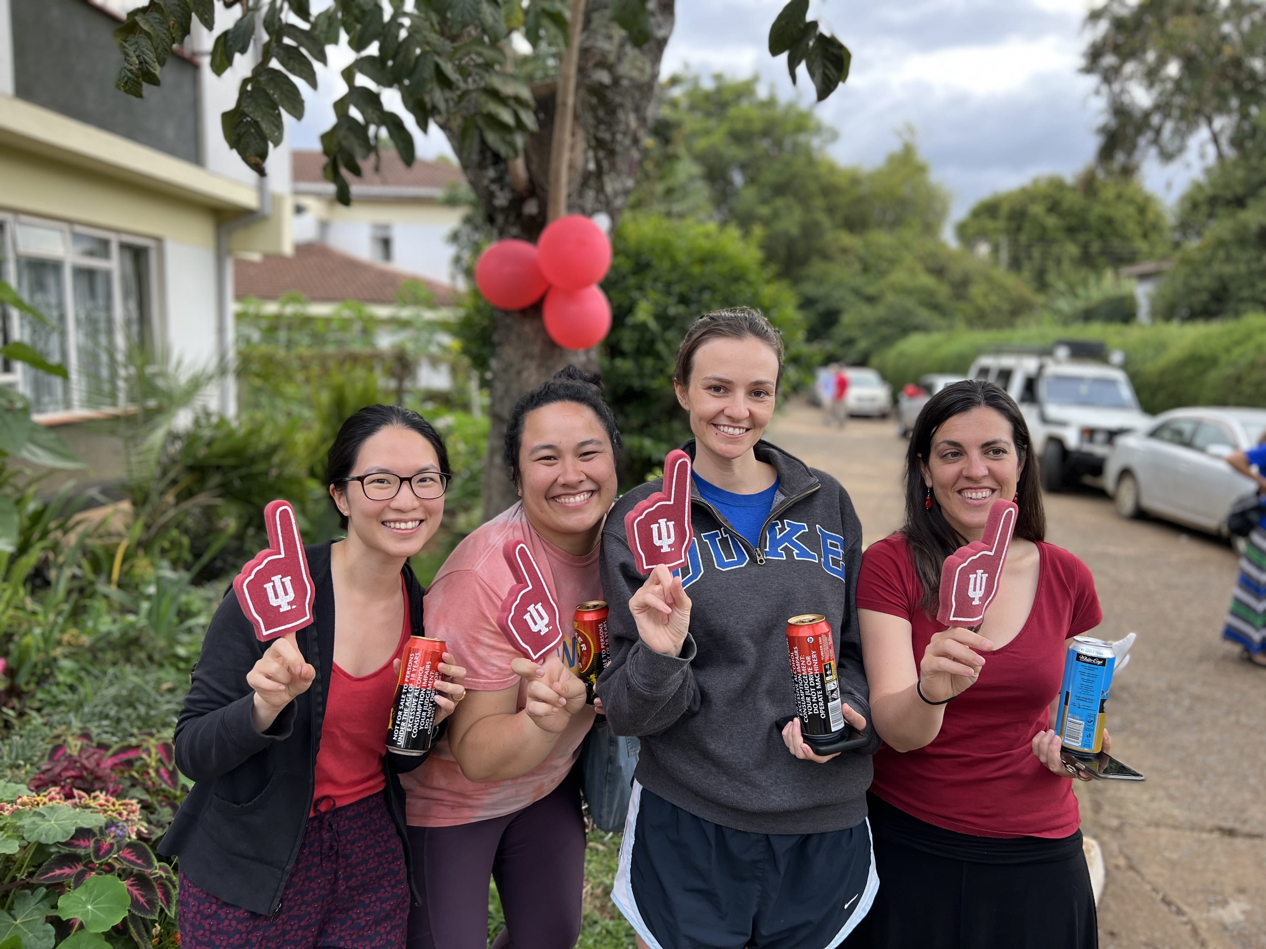 four IM residents hold red IU foam fingers
