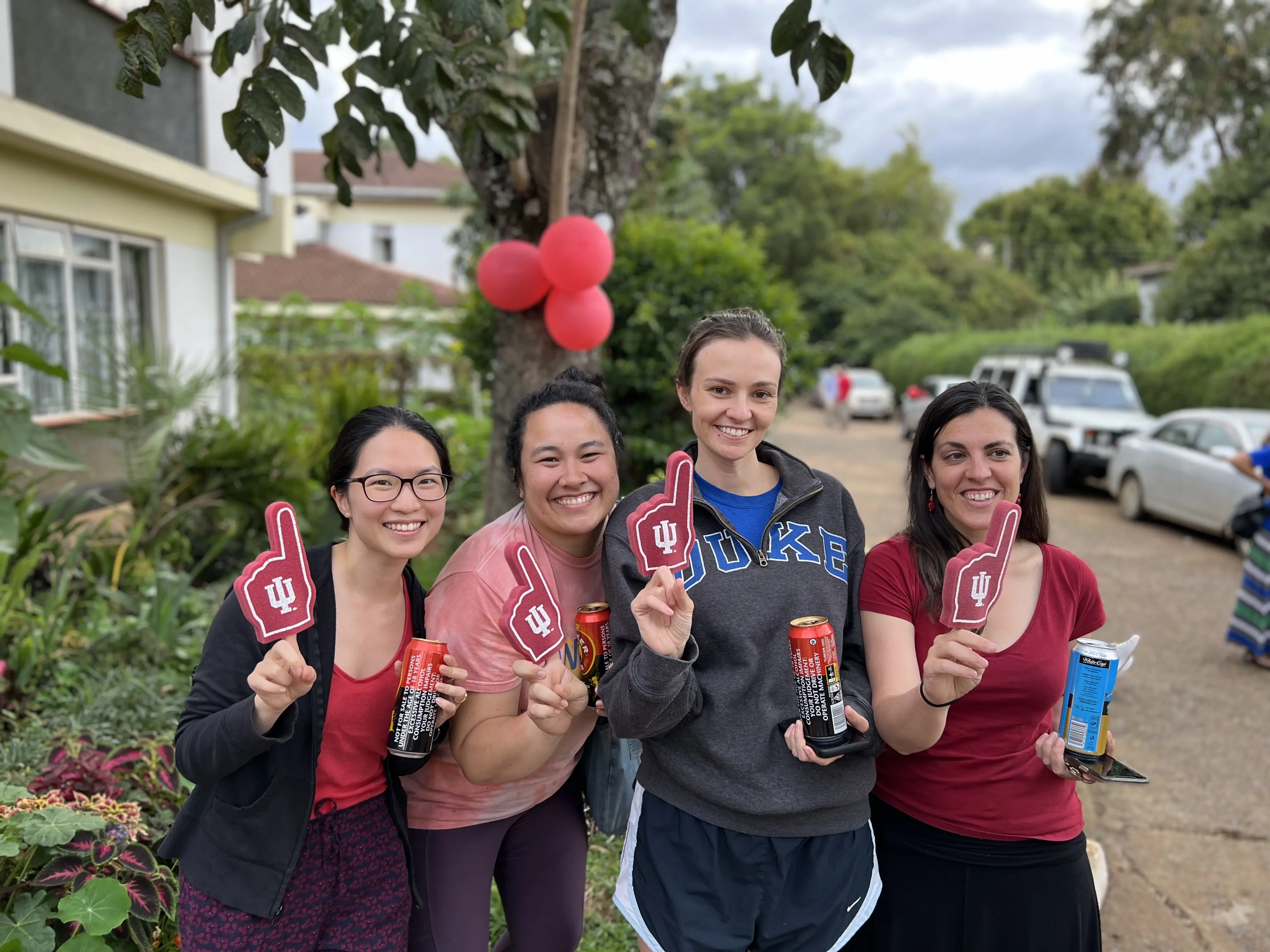 four IM residents hold red IU foam fingers