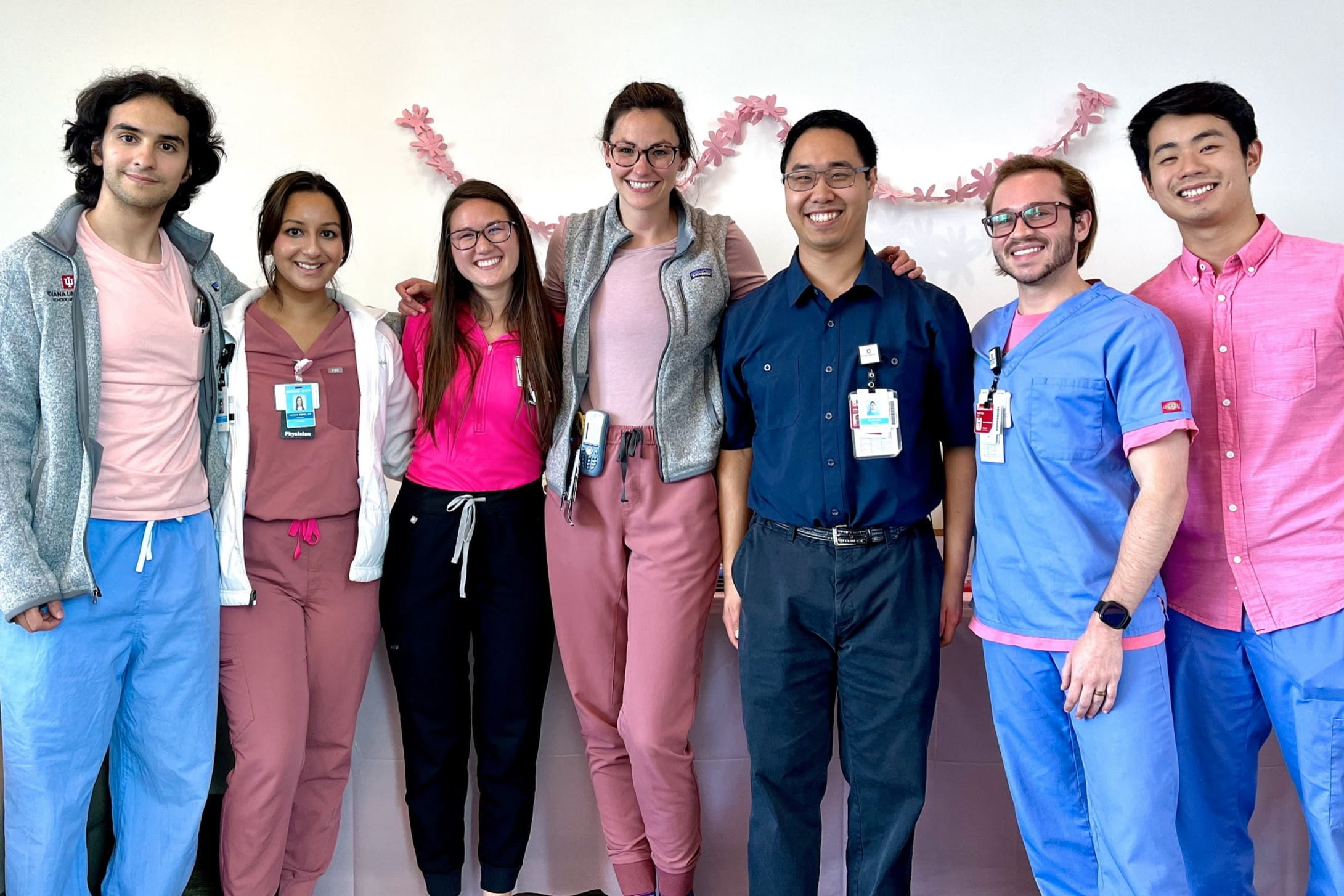 A group of residents all wearing pink.