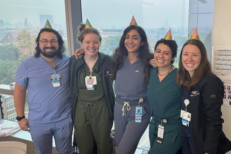 A group of residents in party hats.