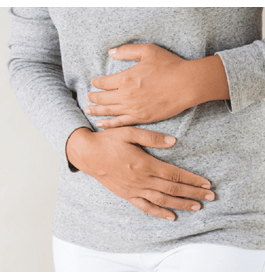Photo of a person holding their stomach, related to irritable bowel syndrome