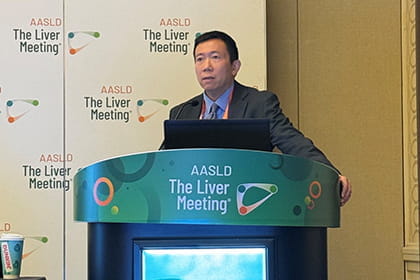 Photo of Dr. Liangpunsakul at AASLD 2023 speaking at a lecture.