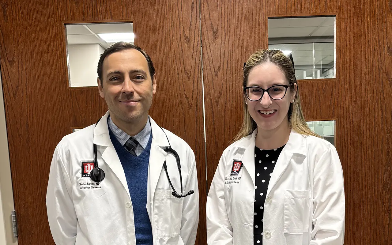 Nicolas Barros (Left) and Dr. Christina Vojtek (Right) standing in front of a pair of doors. Both doctors are Transplant Directors at IU Health University Hospital and IU Health Methodist Hospital respectively. | Photo by Caitlin VanOverberghe, IU School of Medicine Dr. Nicolas Barros (Left) and Dr. Christina Vojtek (Right) standing in front of a set of doors.