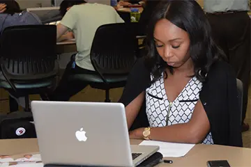 A student works on their laptop during class