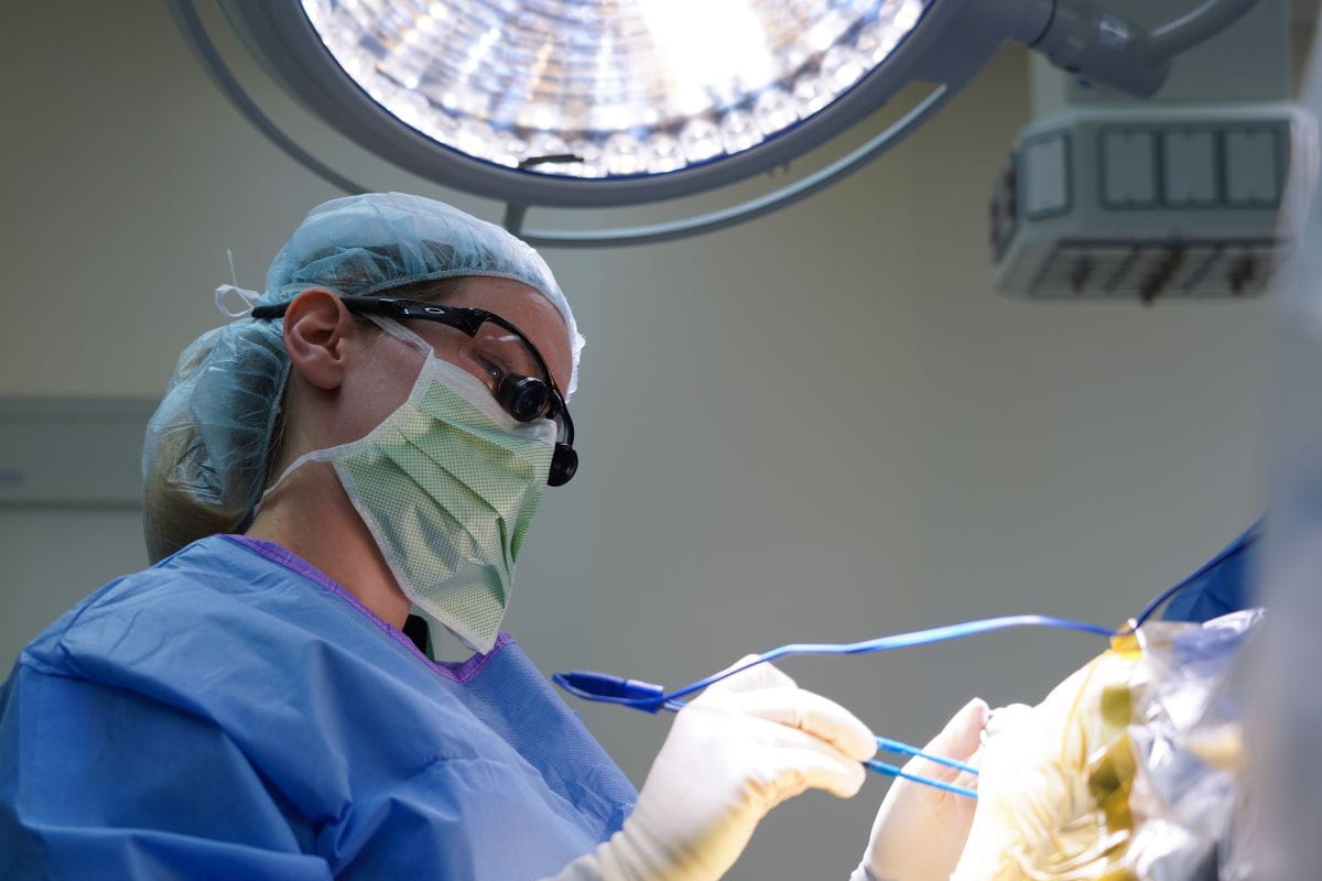 A neurosurgeon performs surgery in the OR