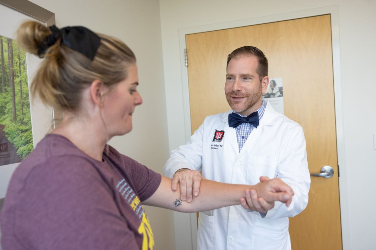 Dr. Bradbury examines a clinic patient