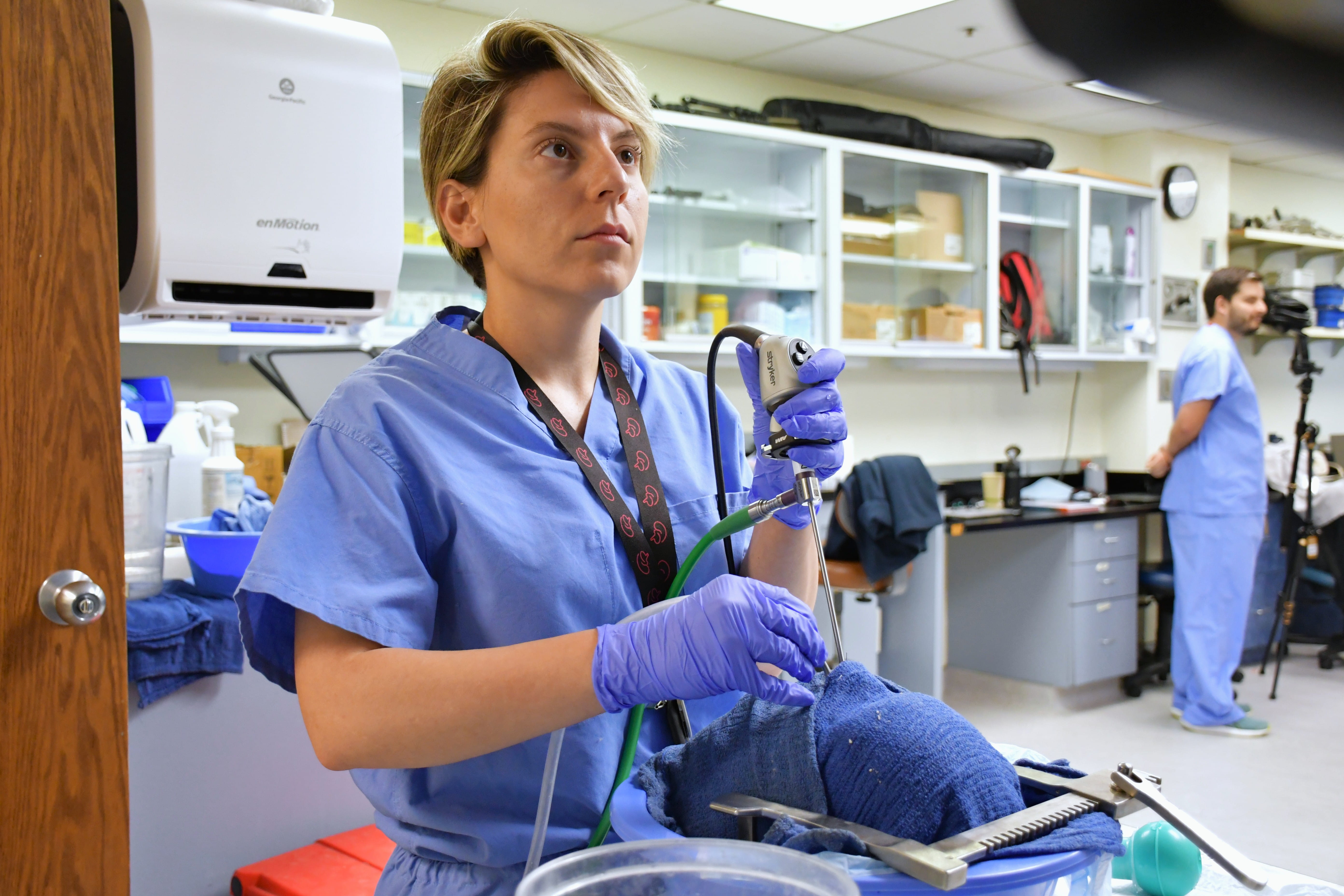 A neurosurgery fellow conducting research in the lab