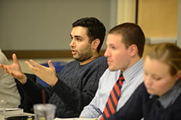 a person responds to a question in a meeting