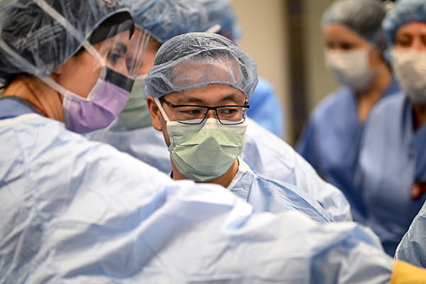 Dr. Jason Chu performing surgery in the OR
