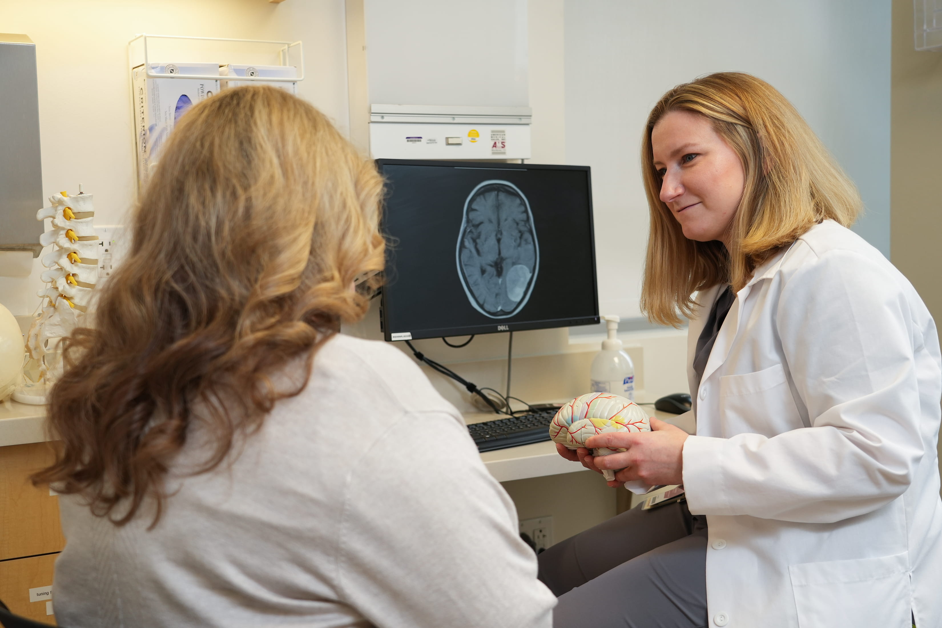 Dr. Angela Richardson meets with a patient in the clinic