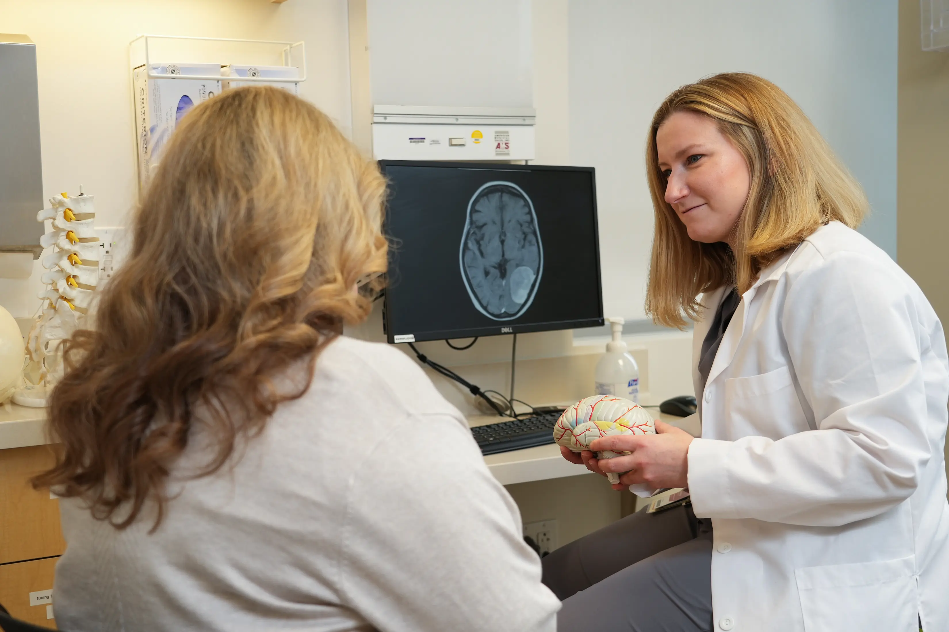 Dr. Angela Richardson meets with a patient in the clinic