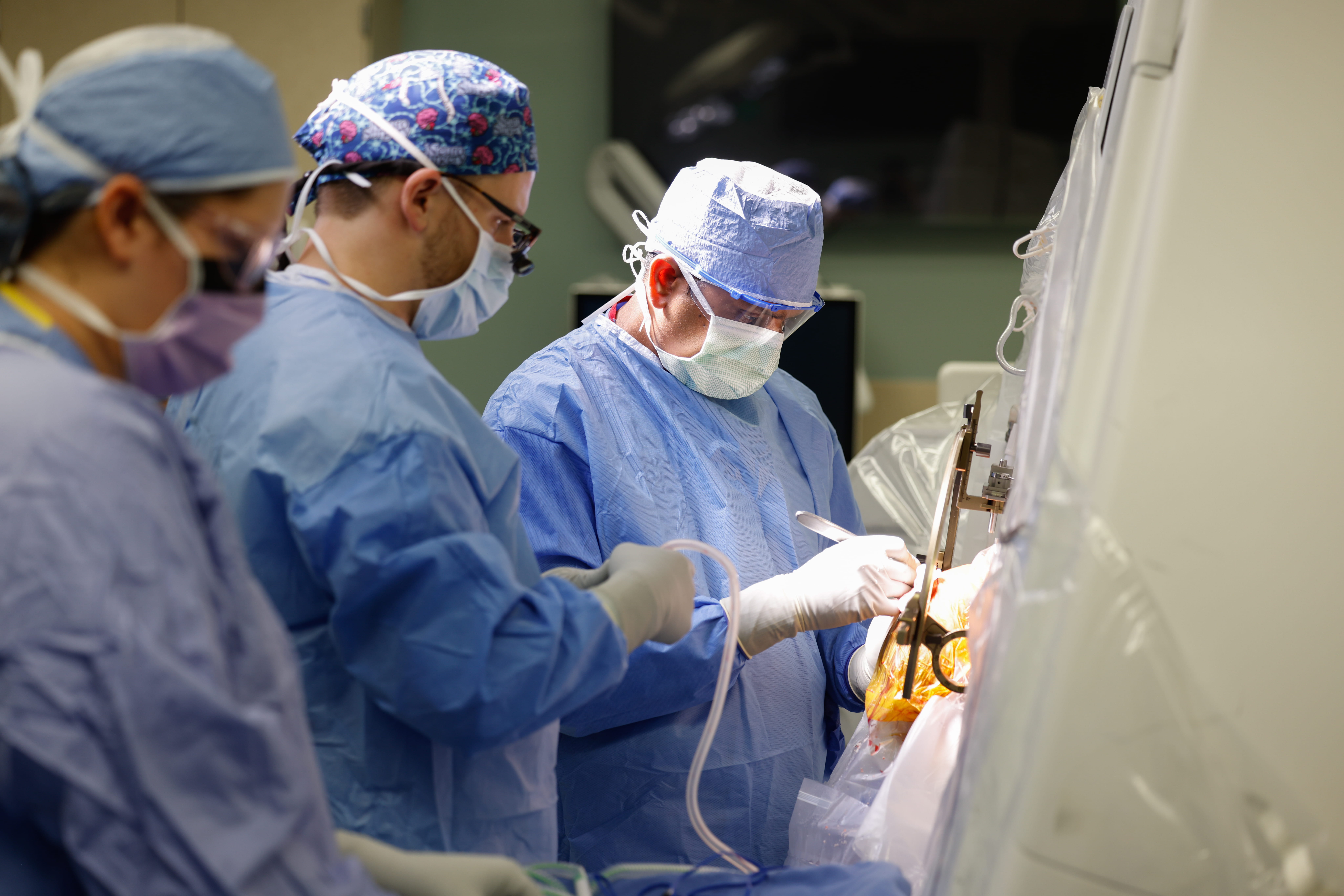 Neurosurgeons performing a surgery in the operating room