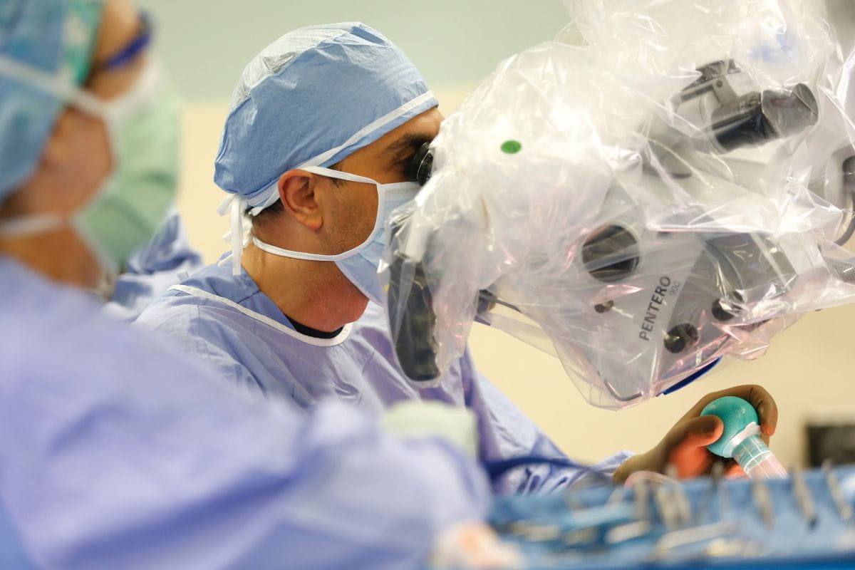 neurosurgeons perform surgery in the OR