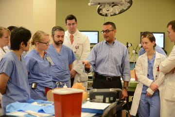 faculty and residents train in a surgical skills lab