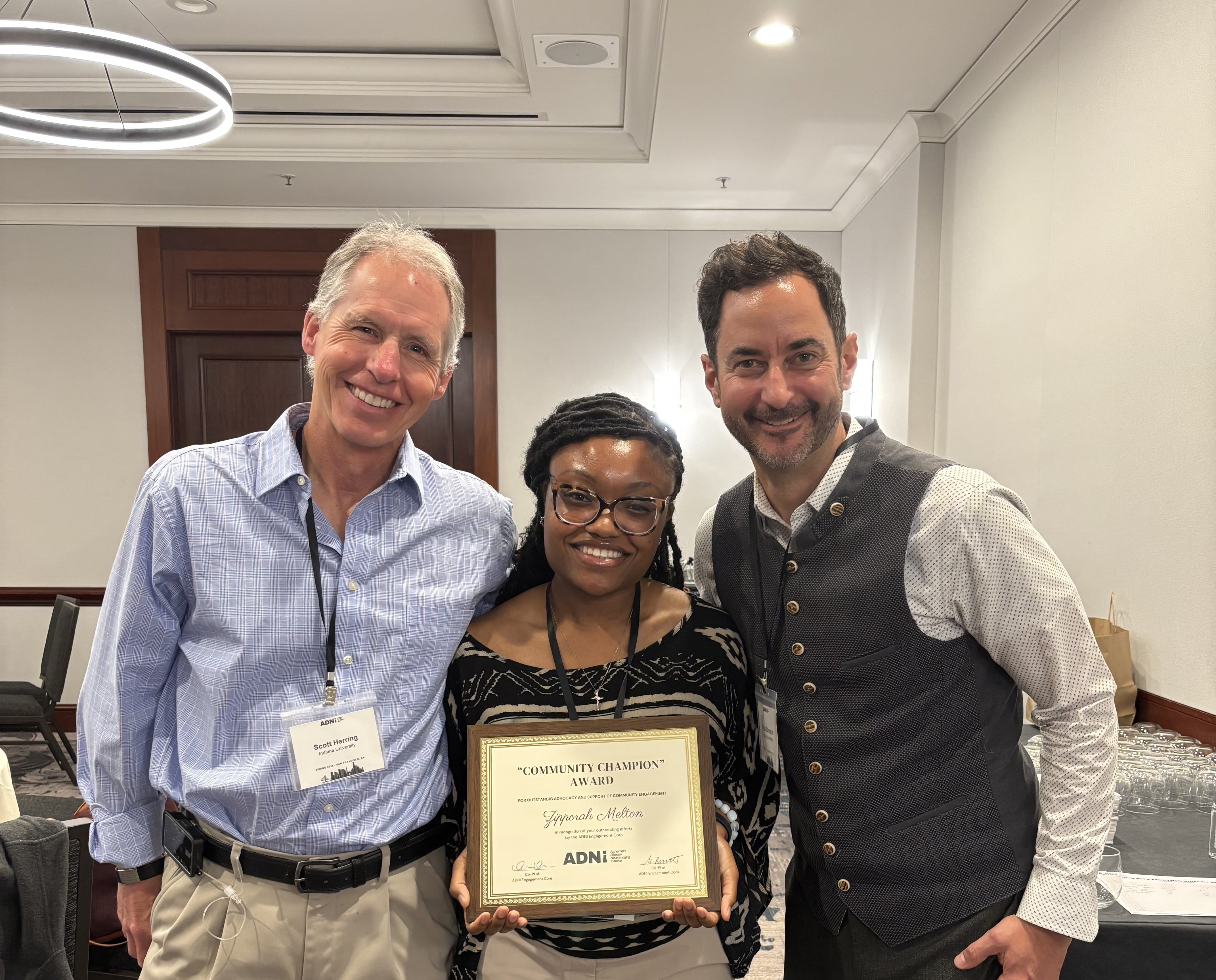 Scott Herring, Zipporah Melton and Jared Brosch at an awards ceremony