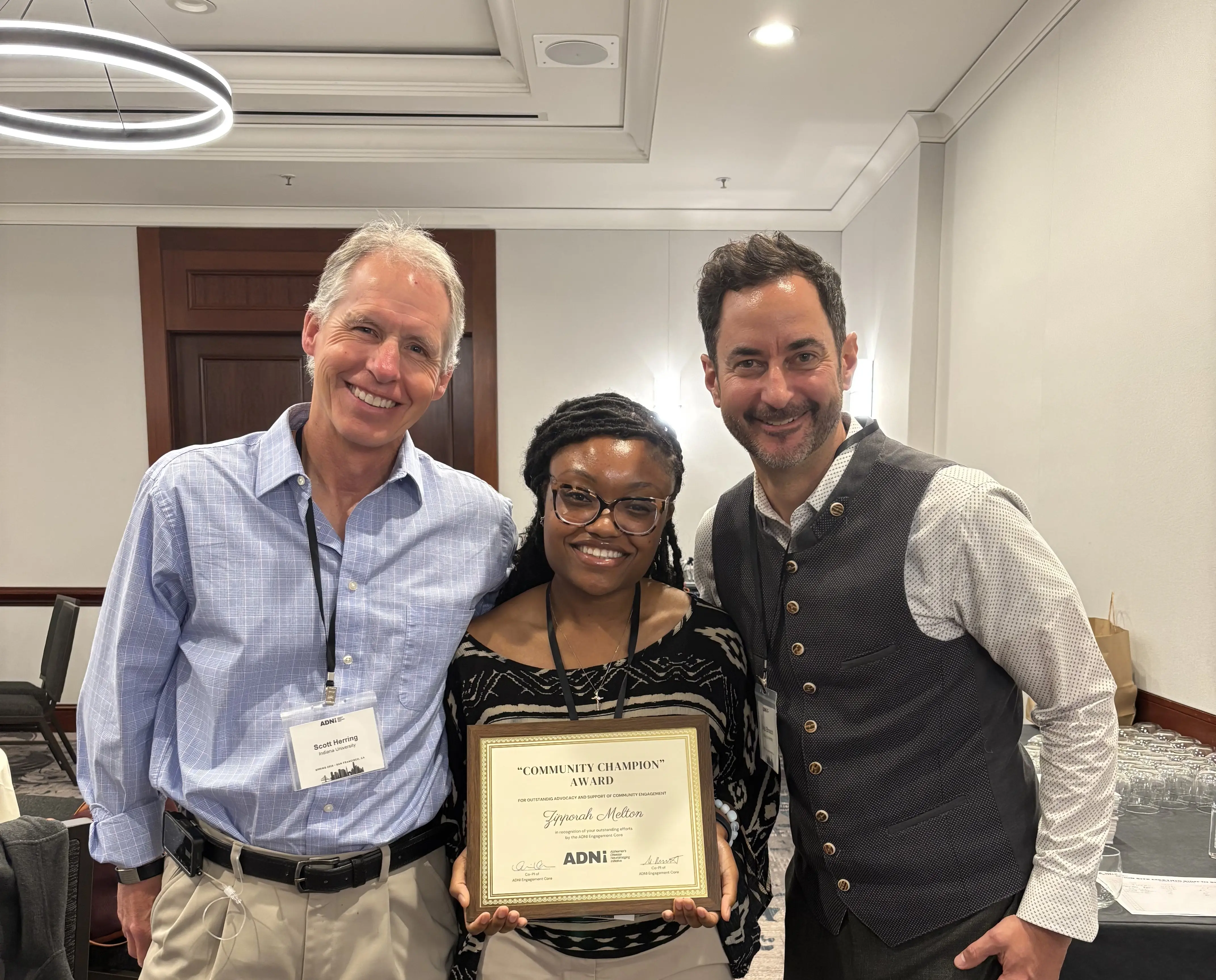 Scott Herring, Zipporah Melton and Jared Brosch at an awards ceremony