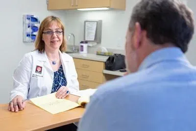 Liana Apostolova, MD meets with a LEADS participant.