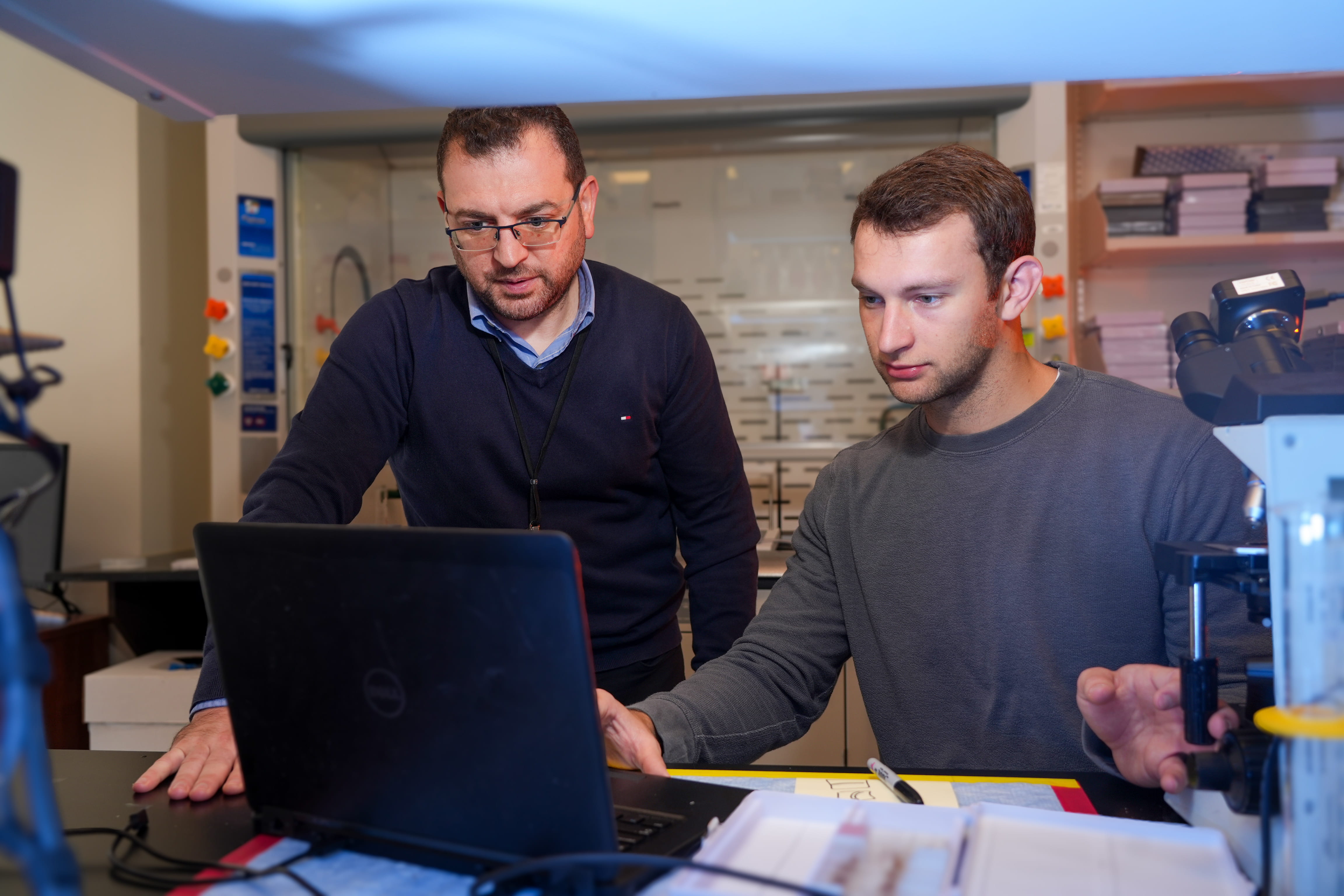 Dr. Makram Obeid in the lab with a student