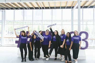 Logan and her peers at the 2023 AAIC in Amsterdam, the Netherlands. A group of Alzheimer's researchers at a conference