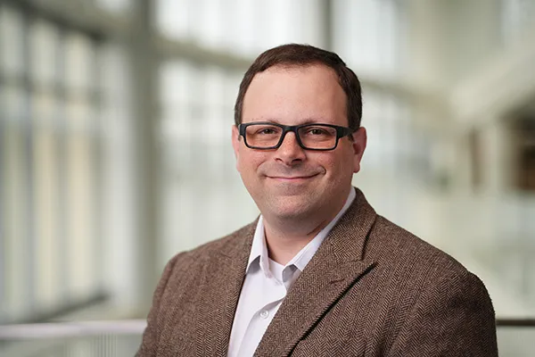 Portrait of Dr. Adam Comer
