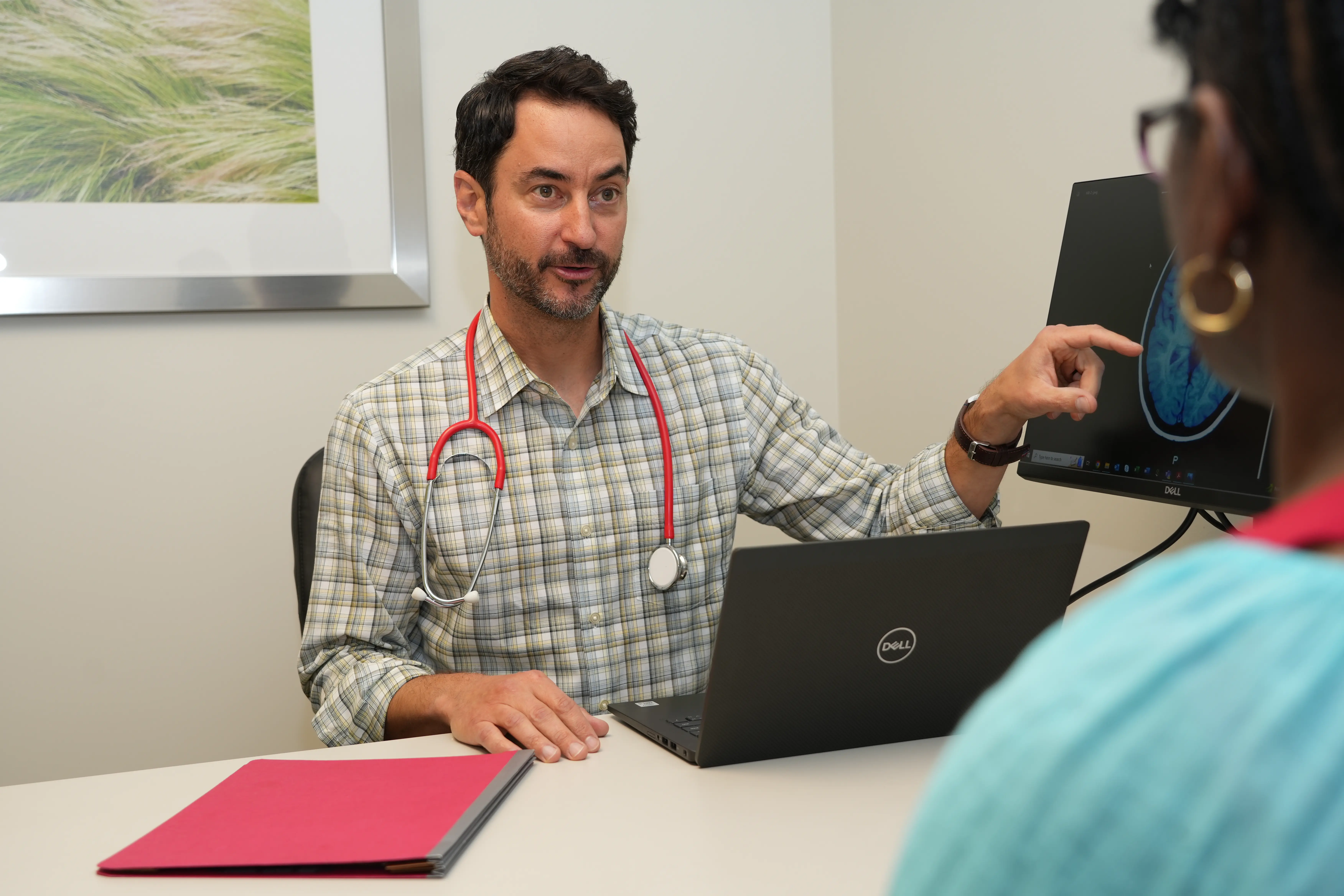 a clinician meets with a clinical trial participant