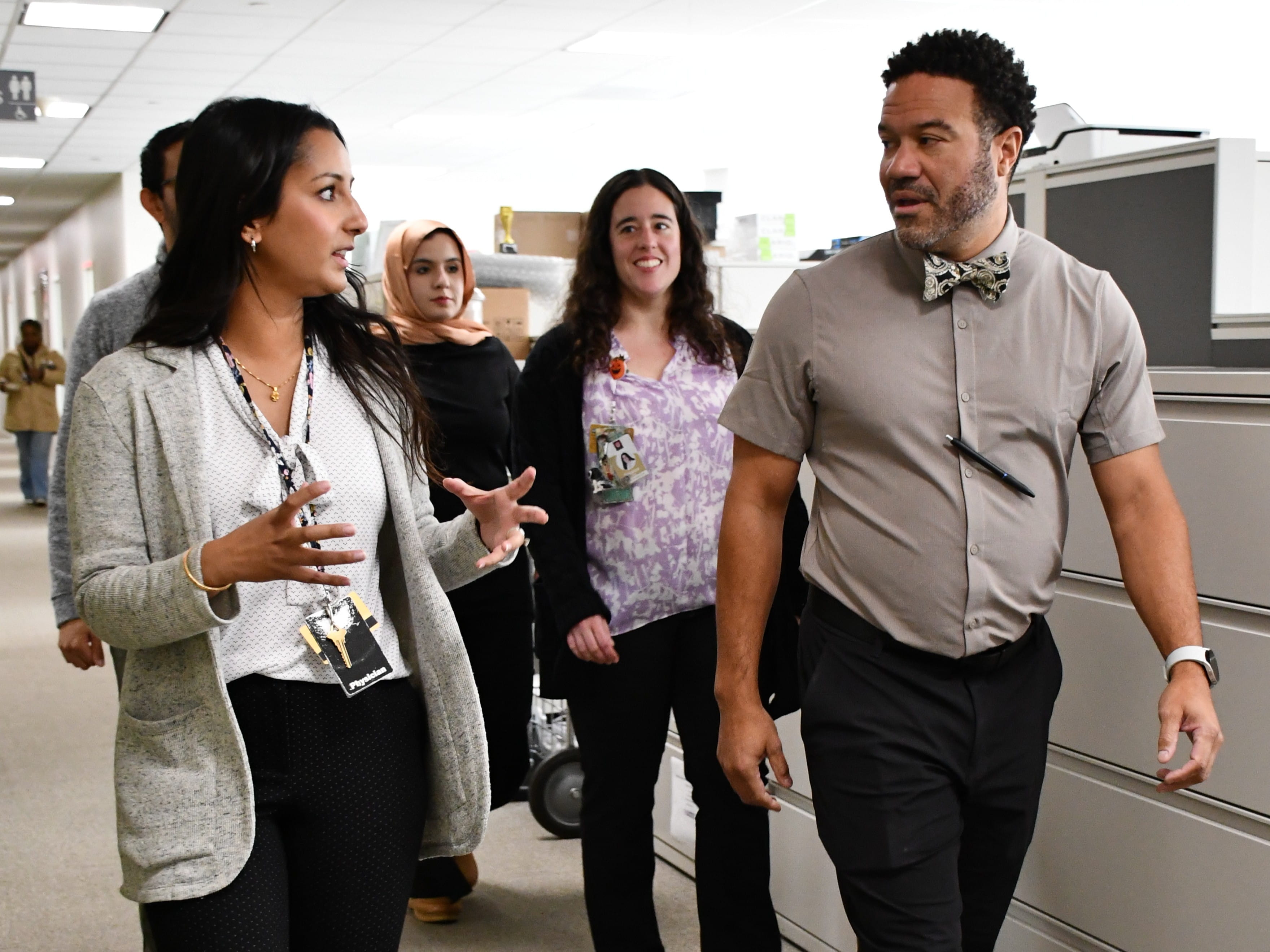 Residents walking and talking in a hallway