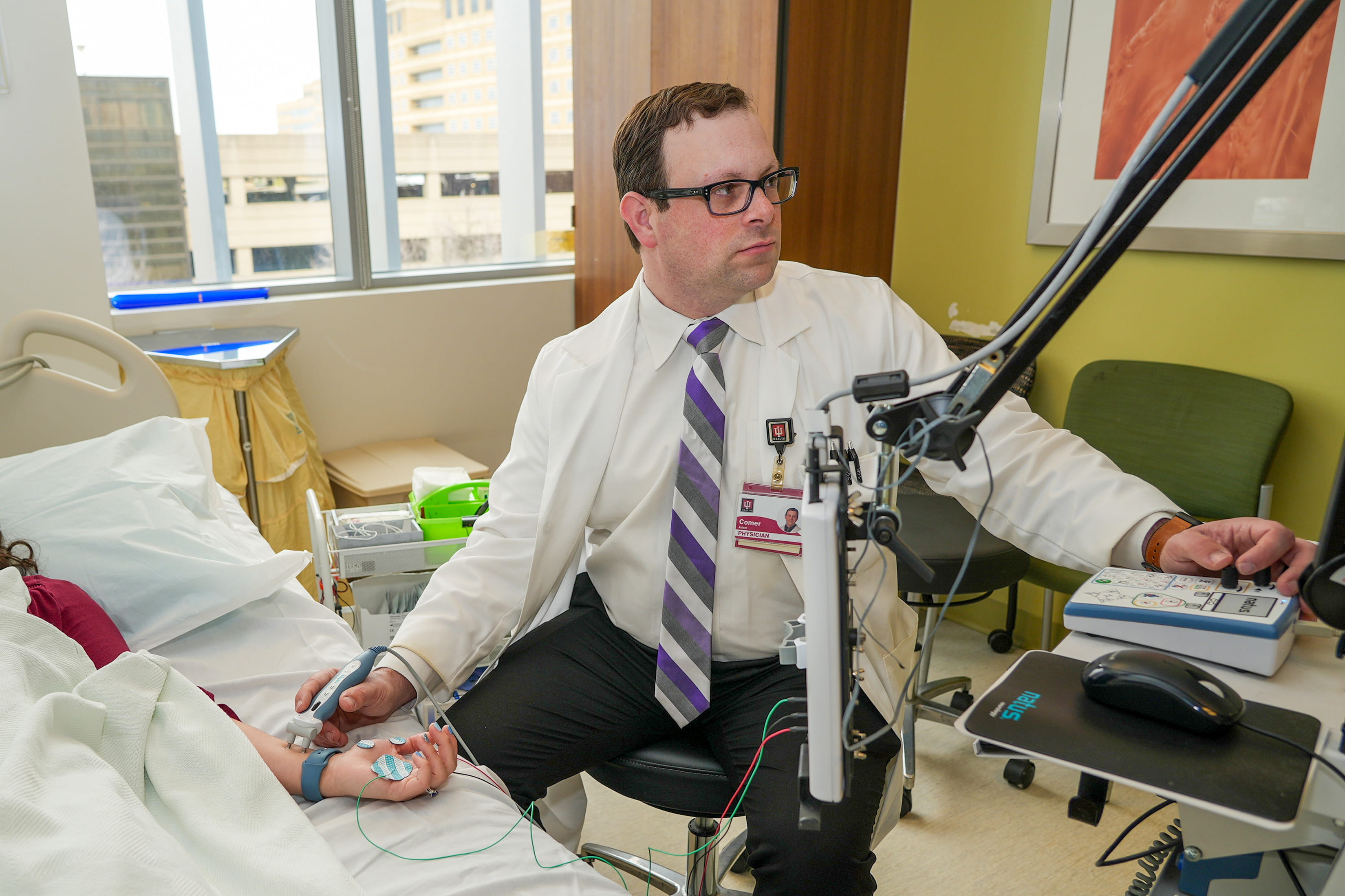 a doctor meets with an ALS patient