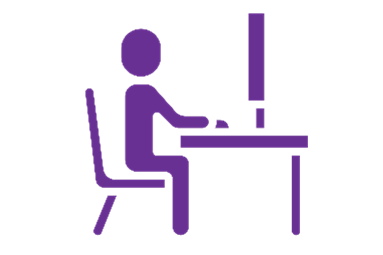 icon of a person sitting at a computer and desk for a test