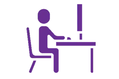 icon of a person sitting at a computer and desk for a test