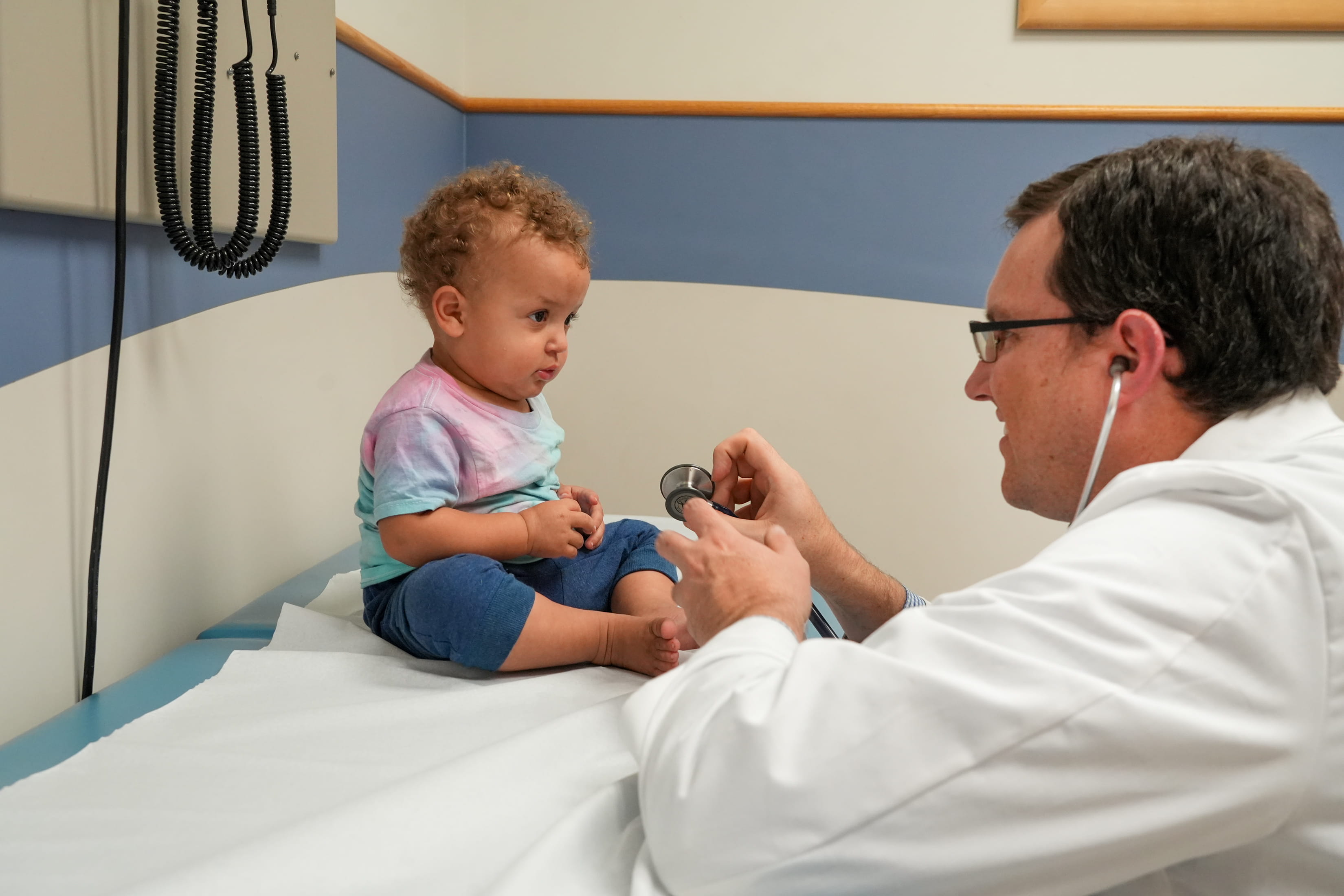 a doctor visits with a child in the clinic