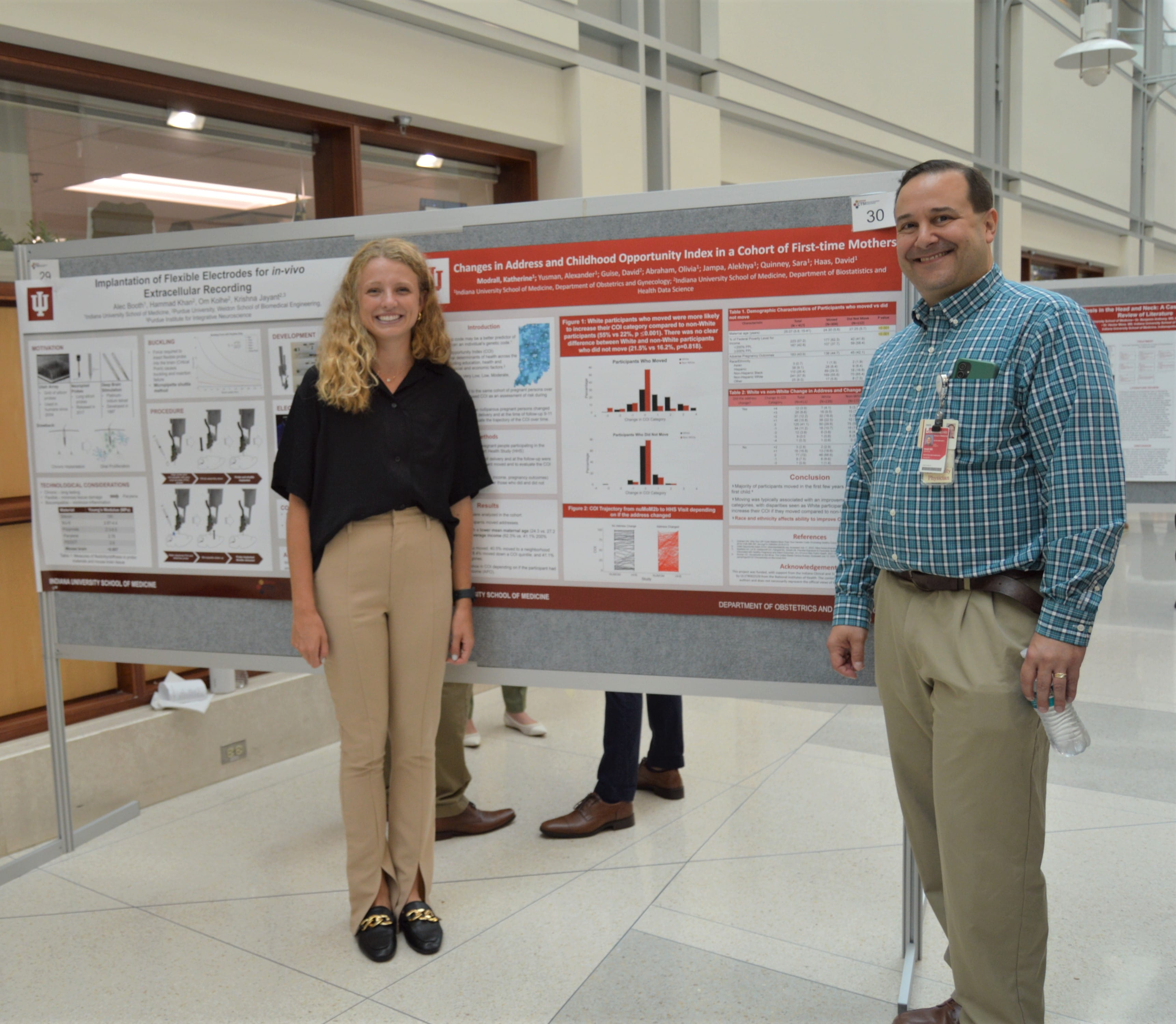 IMPRS research student Katherine Modrall, right, stands with her faculty mentor David Haas during her poster presentation 