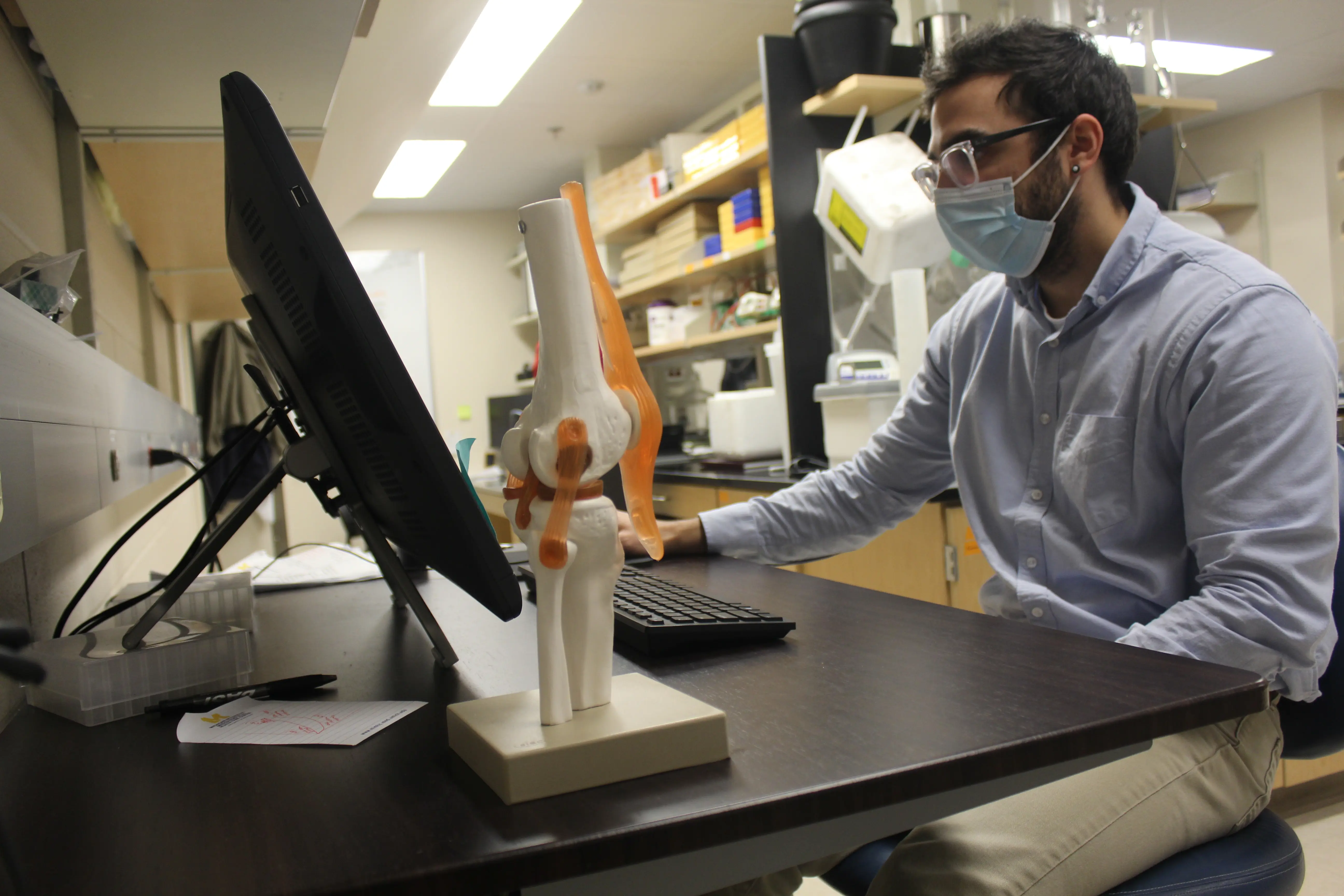 A researcher works at a computer in Schlecht Lab