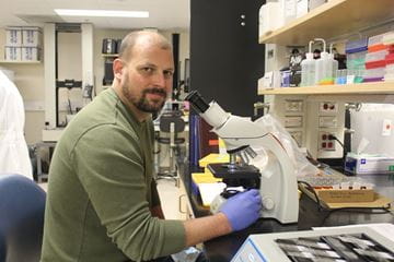 Stephen Schlecht, PhD, works in his lab