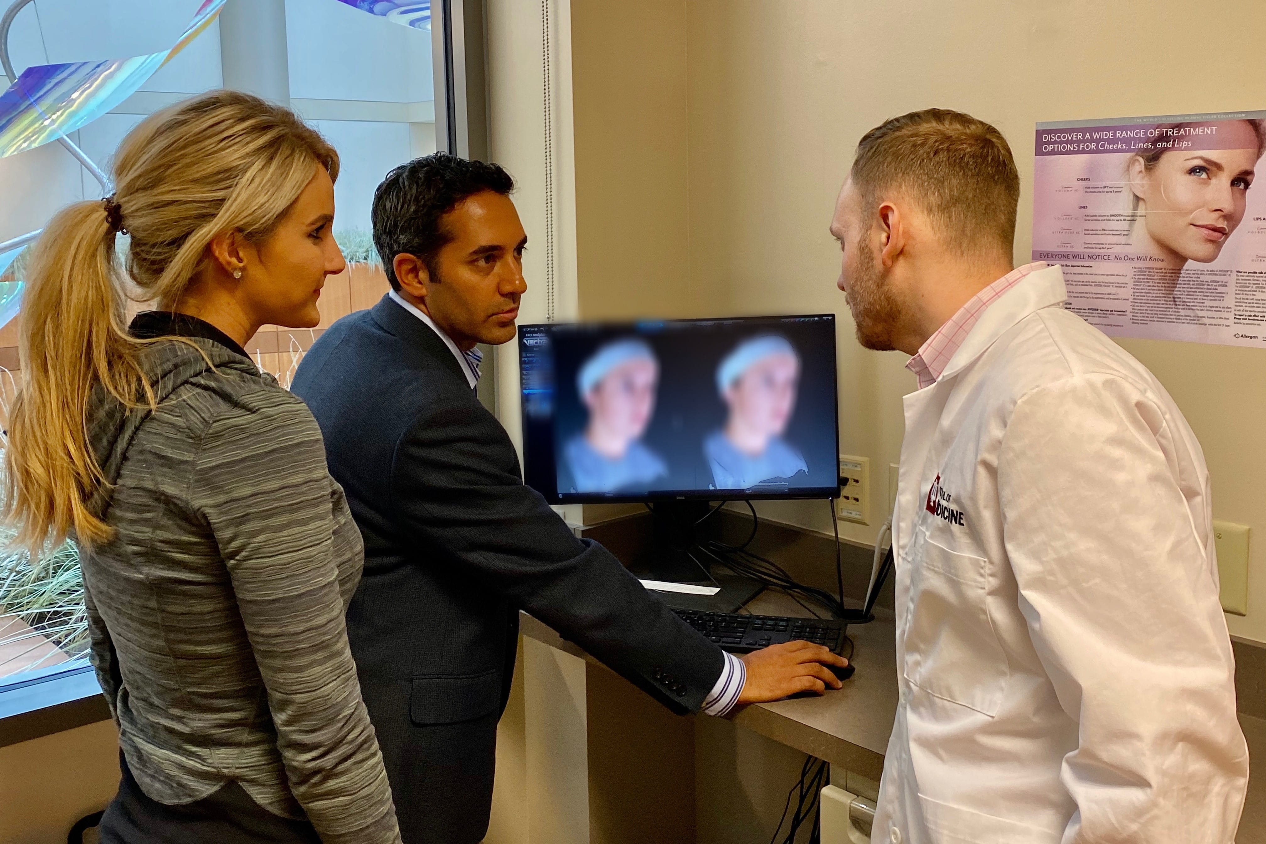 physicians review patient files together in the clinic