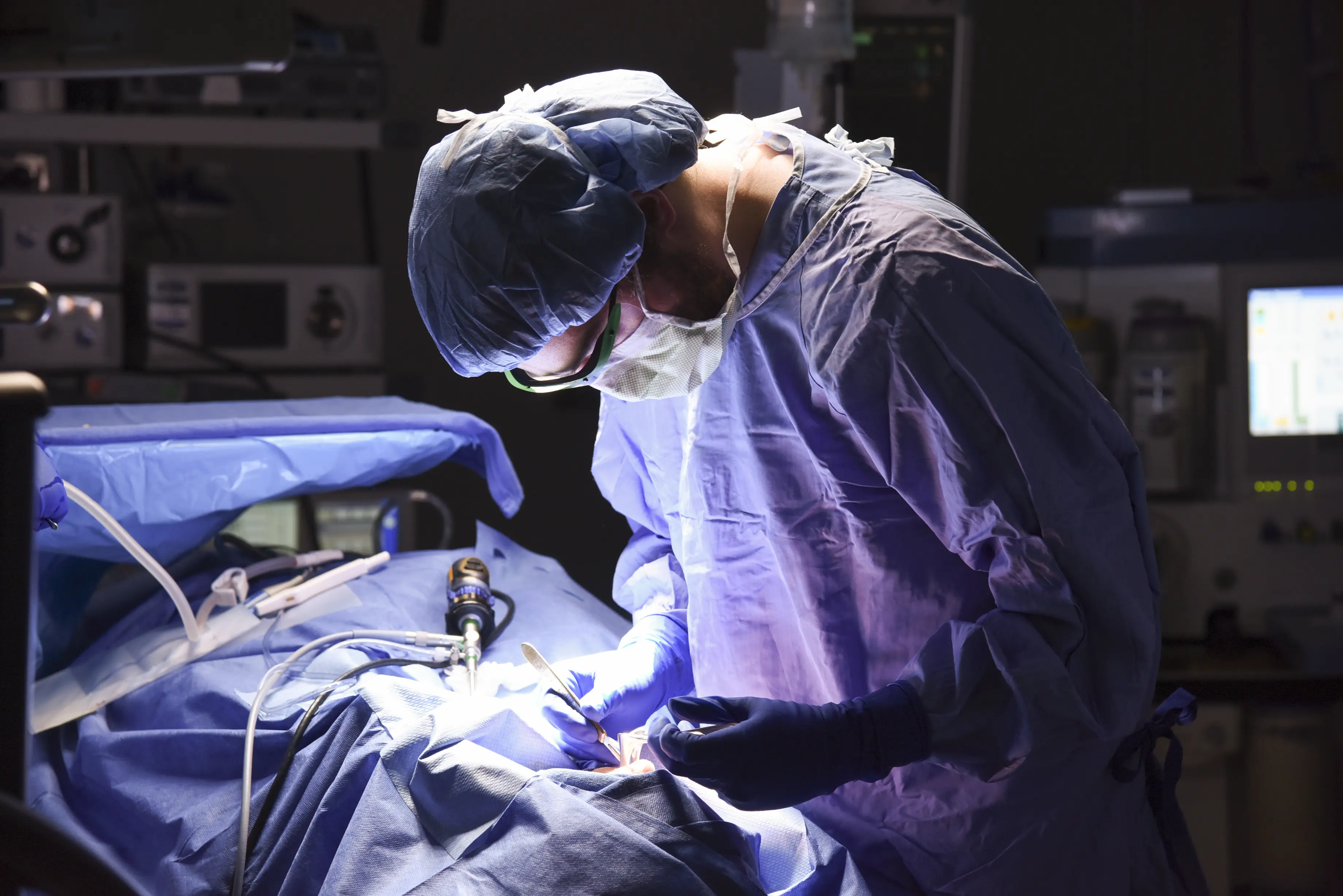 a surgeon at work in the operating room