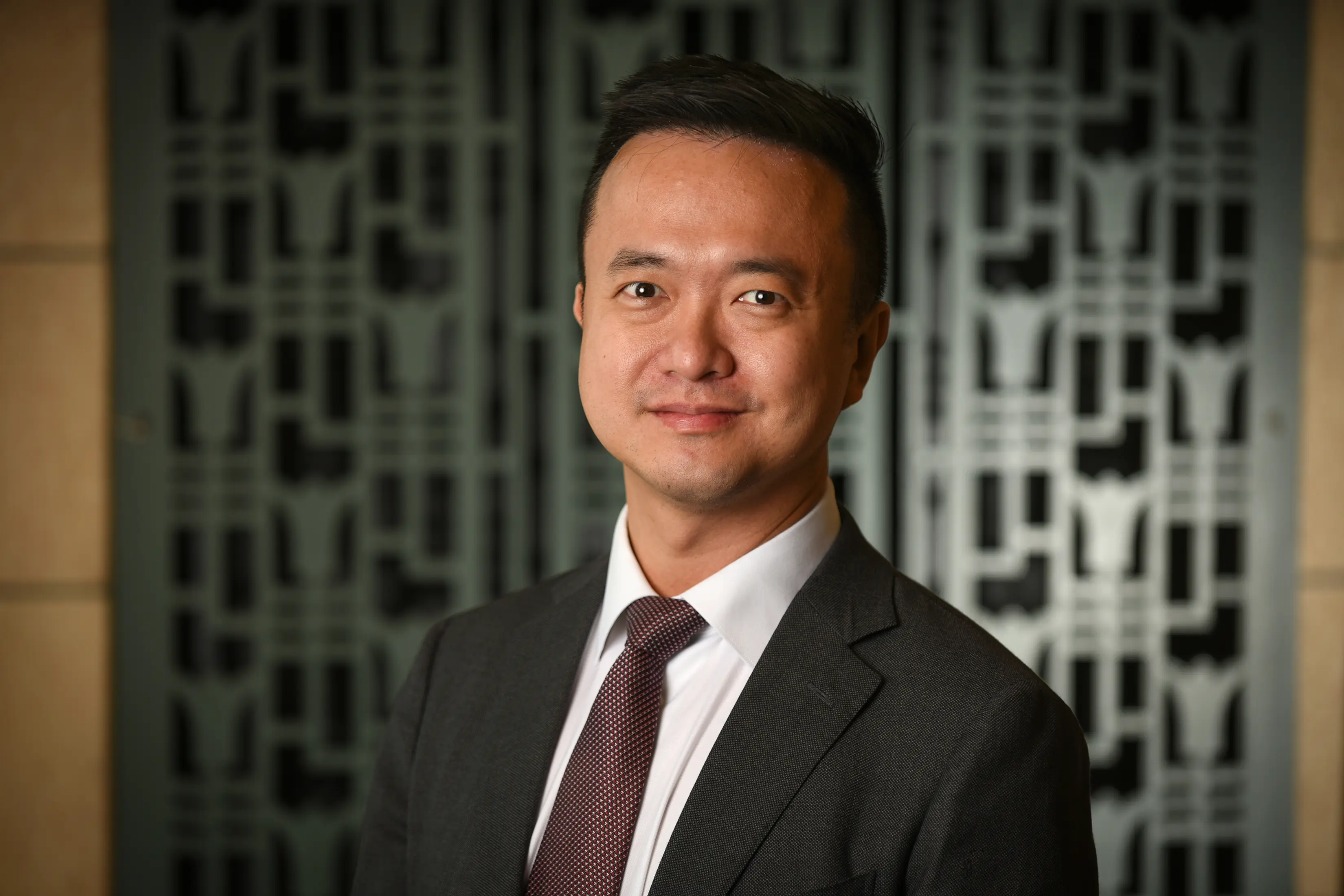 Jon Ting in a suit and tie