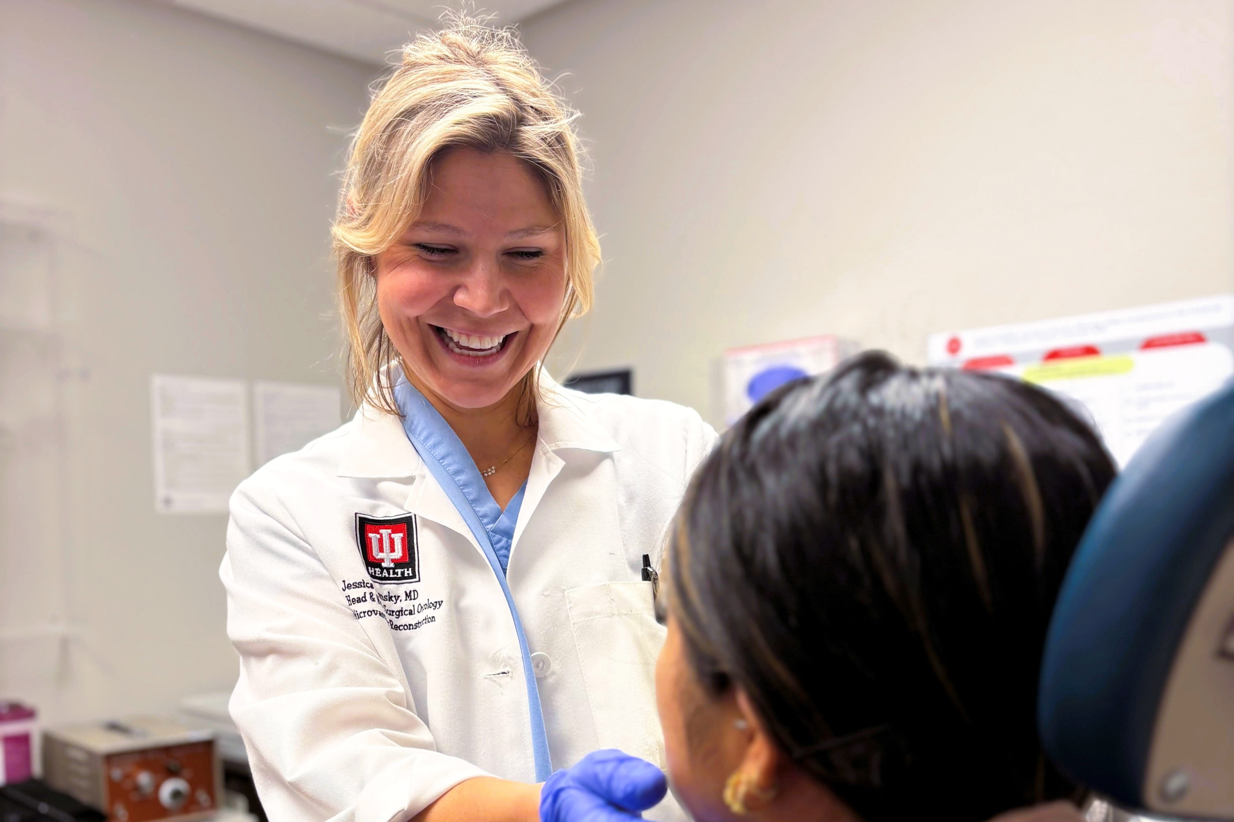 Physician in white coat examining patient