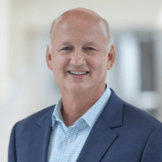 clark day in a suit jacket and blue shirt.