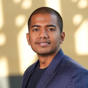 Siddhesh wearing a blue suit jacket