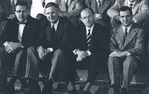 Drs. Beamer, Smith, Schulz and Vellios Drs. Beamer, Smith, Schulz and Vellios sit together as part of a larger group photo