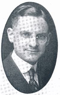 Black and white oval portrait of Dr. Forry, wearing a suit and tie and glasses